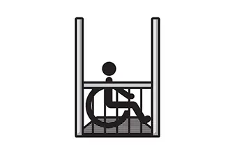 Person in a wheelchair inside a home elevator, emphasizing accessibility and mobility for disabled individuals.